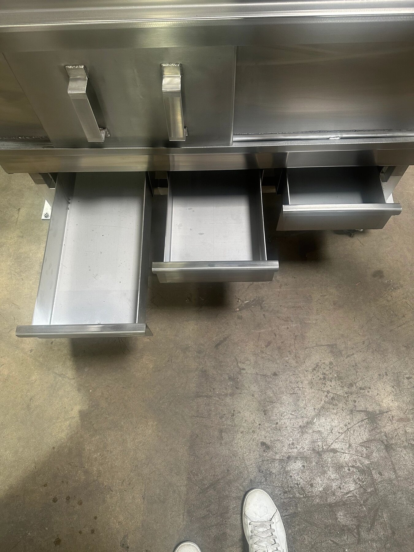Removable ash drawers on a Cline's custom grill